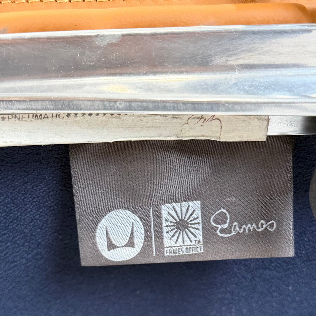 A Pair of  Eames Aluminum Group Executive Chairs