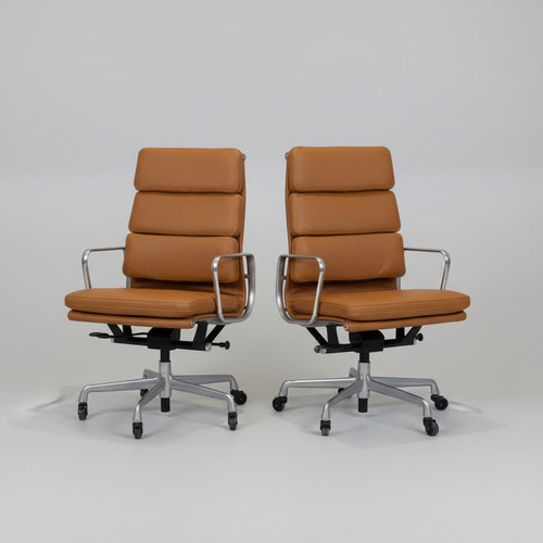 A Pair of  Eames Aluminum Group Executive Chairs